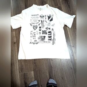 - Sean Jean XL 100 % cotton Tee shirt.  White with scripted graphics. EUC.